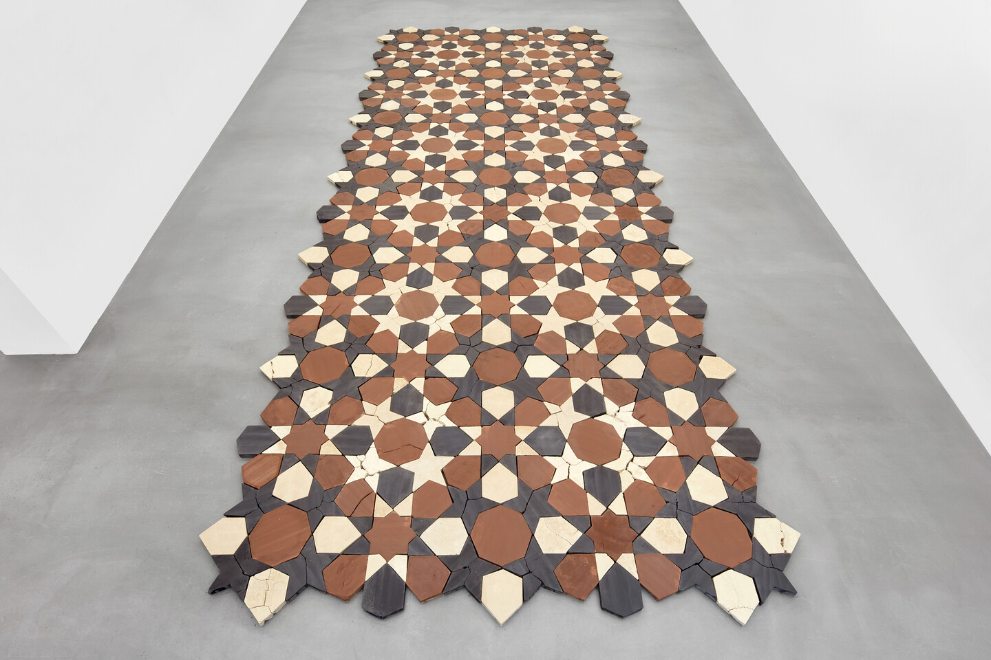 Standing by the Ruins, 2024, compressed earth, hand-tinted with natural pigments, dimensions variable