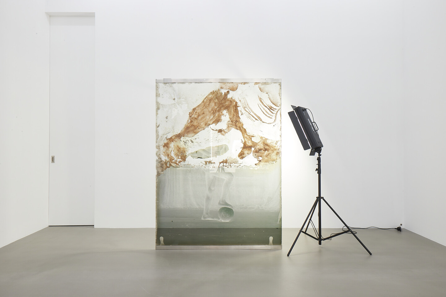 Akram Zaatari, Archeology, 2017, Pigment inkjet print on gelatin treated glass and mixed media, Pigment inkjet print on gelatin treated aluminum sheet, Floor standing preservation flood light, 210 x 160 cm