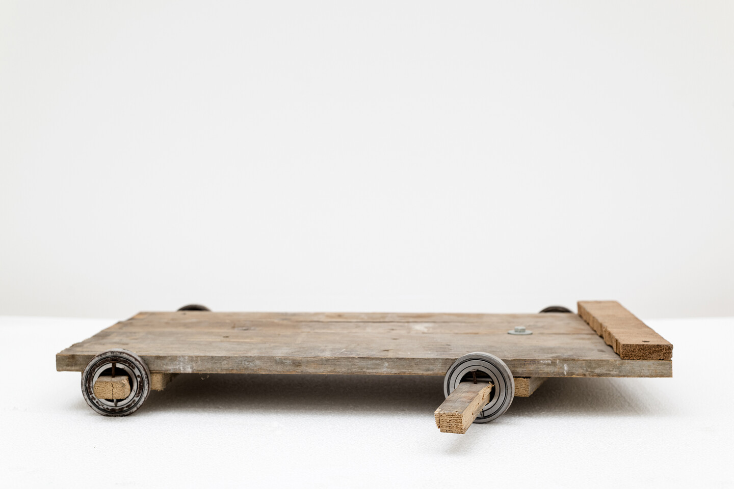 Ball Bearing Cart, 2024, Wood and metal, 35 × 65 cm