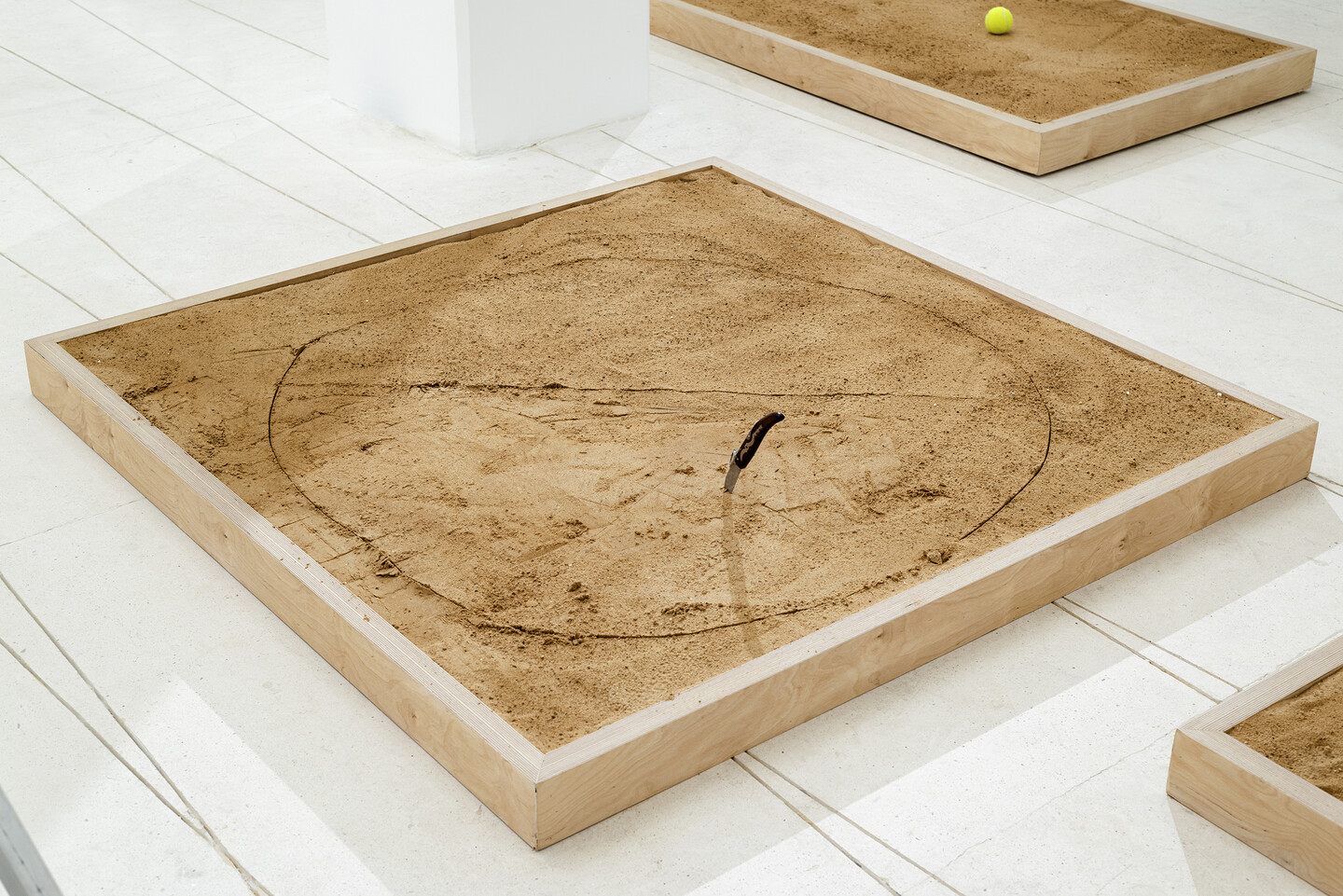 Pinch, 2024, Stainless steel and wooden knife, sand, wood, 150 × 150 × 10 cm